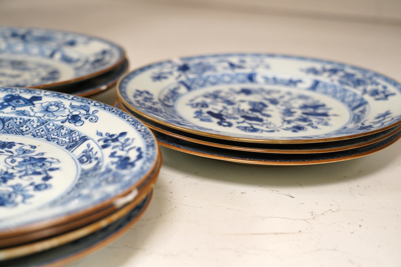 Ten 18th century Chinese export blue and white porcelain plates, each 23cm diameter. Condition - fair, some minor chipping